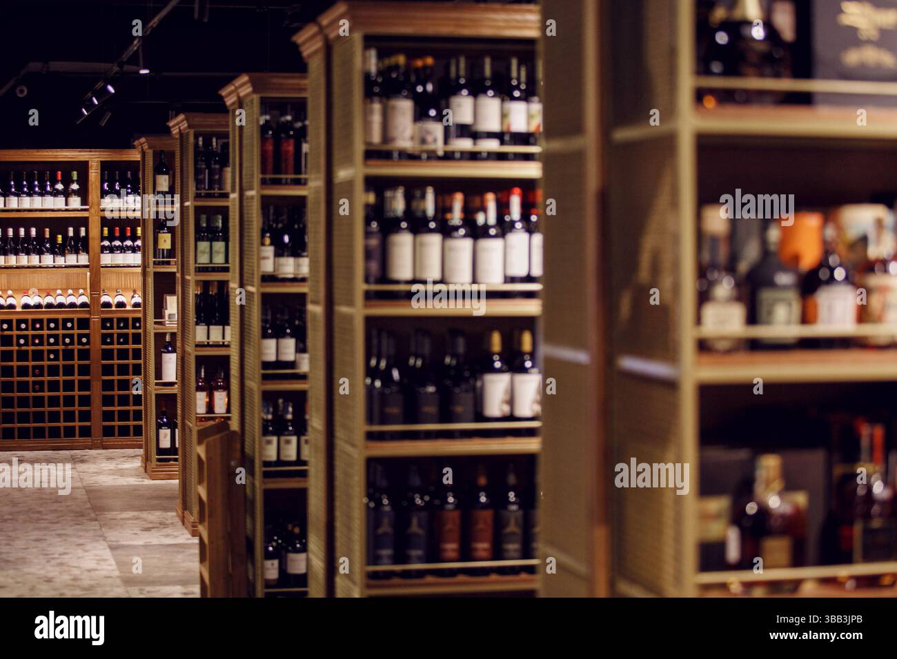 Elegant Wine Shop Interior with Assorted Bottles Stock Photo - Alamy
