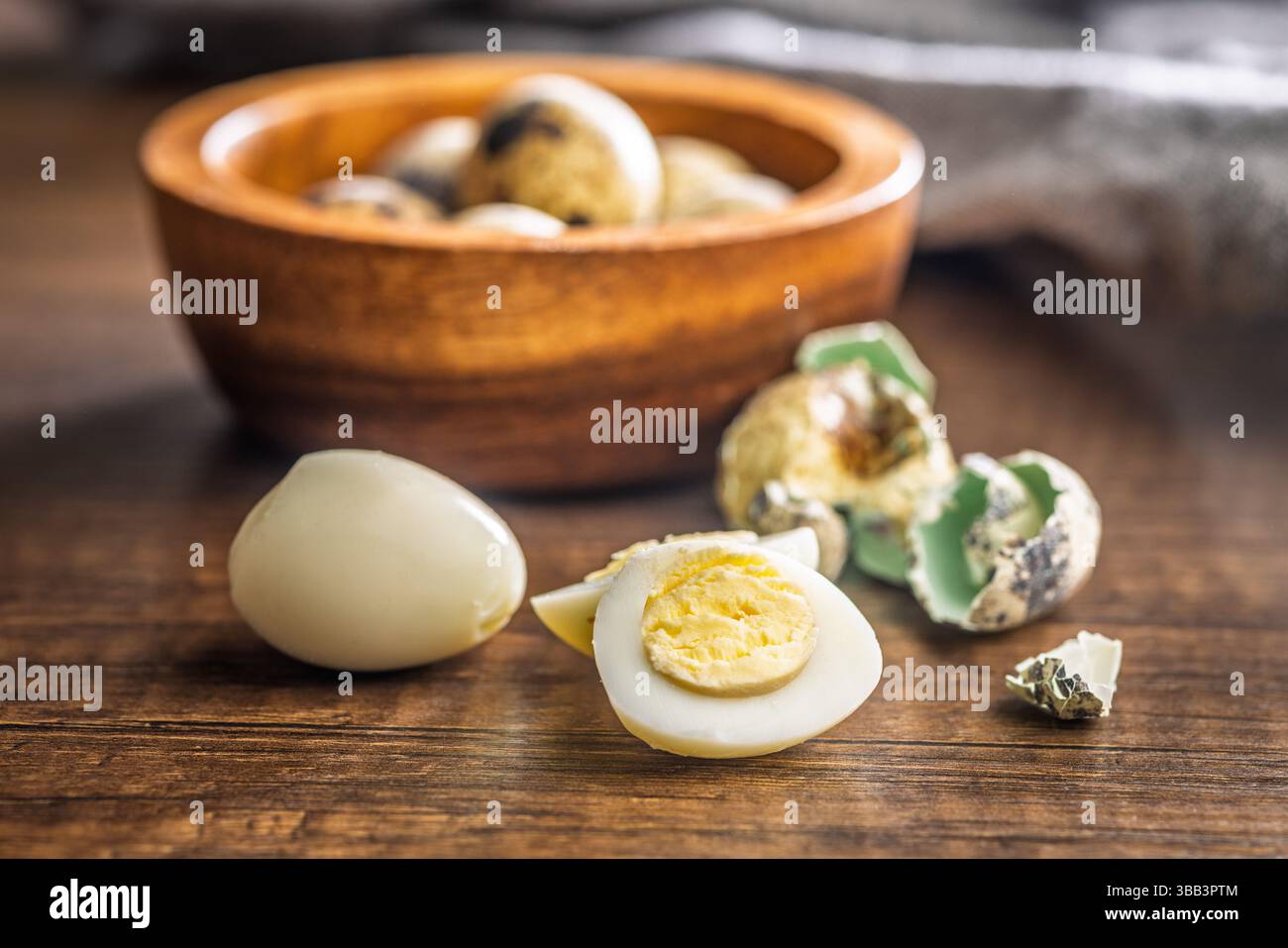 Boiled quail eggs on a wooden table. Stock Photo