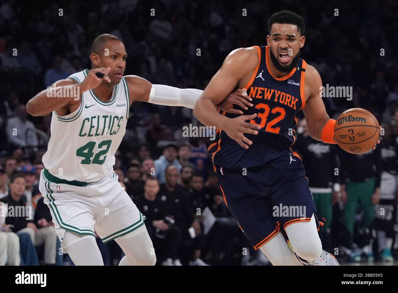 New York Knicks' KarlAnthony Towns (32) drives past Boston Celtics' Al