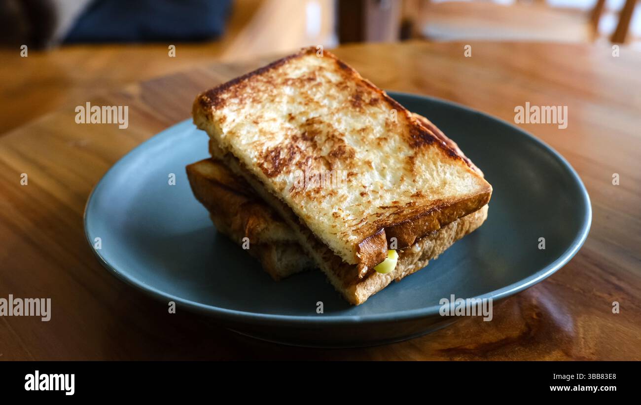 Roti Bakar Selai Srikaya, toasted brioche loaf with kaya jam Stock ...