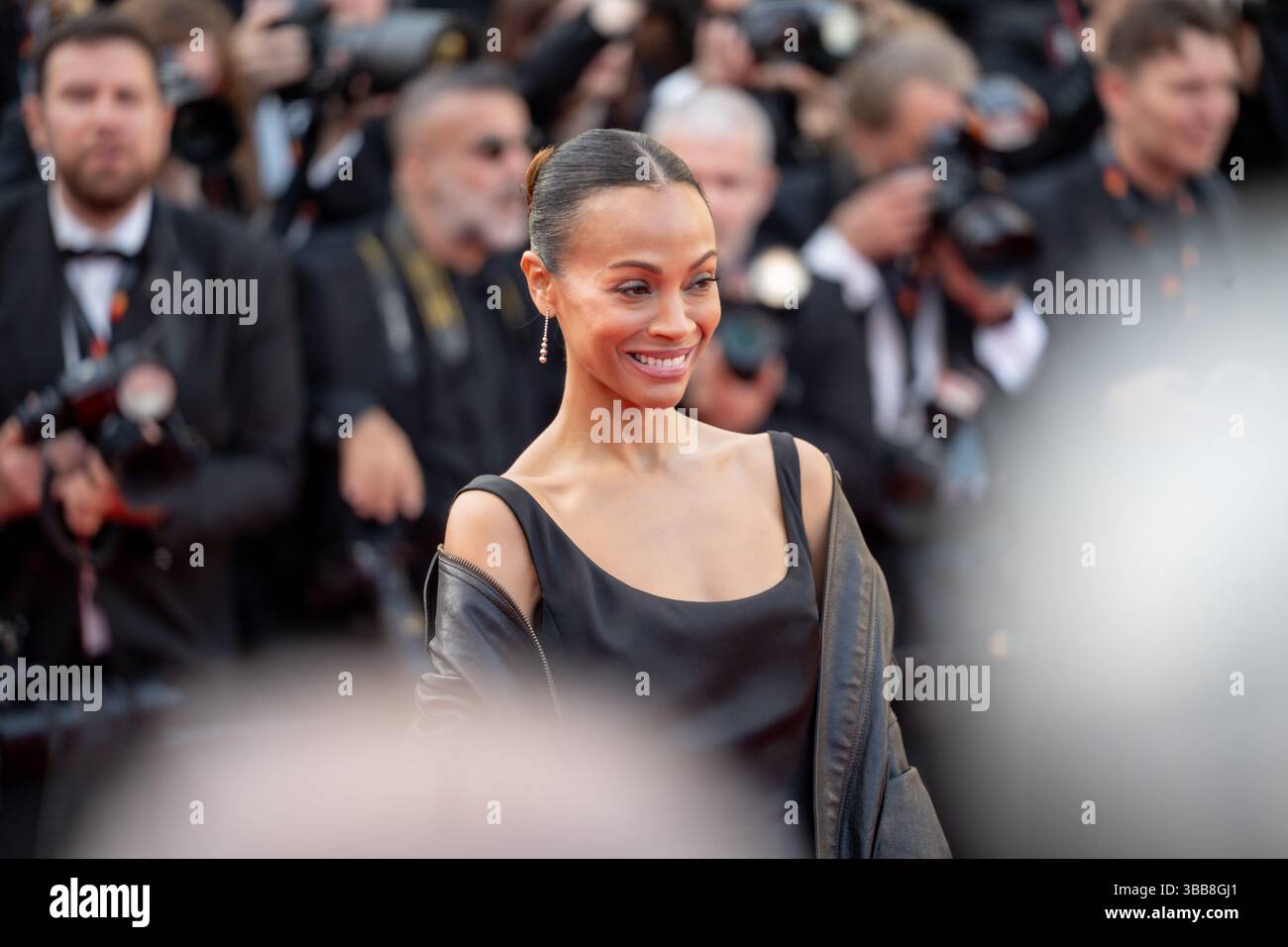 Zoe Saldana attends the ''Mission Impossible - The Final Reckoning ...