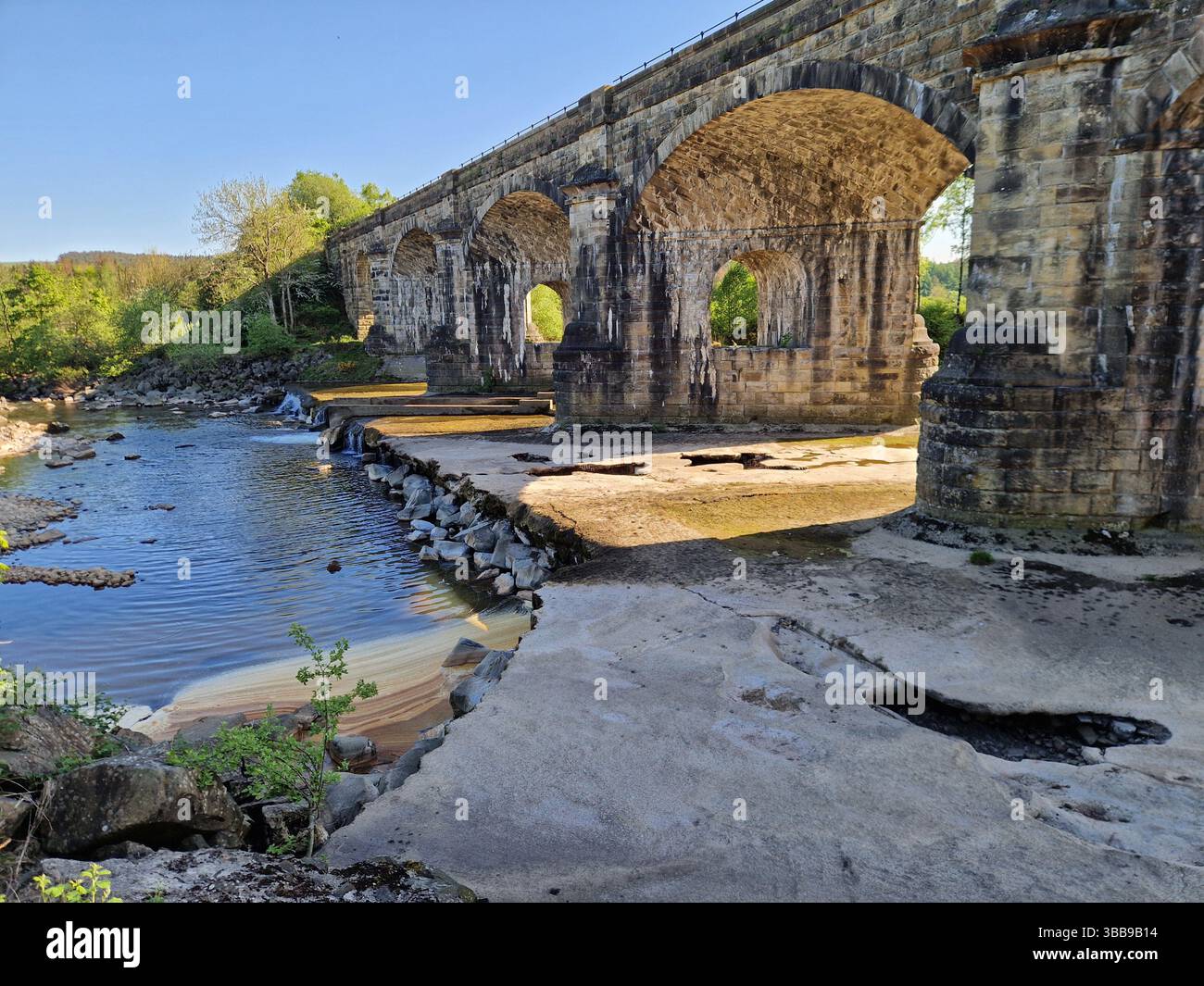 Low river level on the South Tyne, Northumberland after a very dry Spring in May  2025 - Smartphone Captured Stock Image
