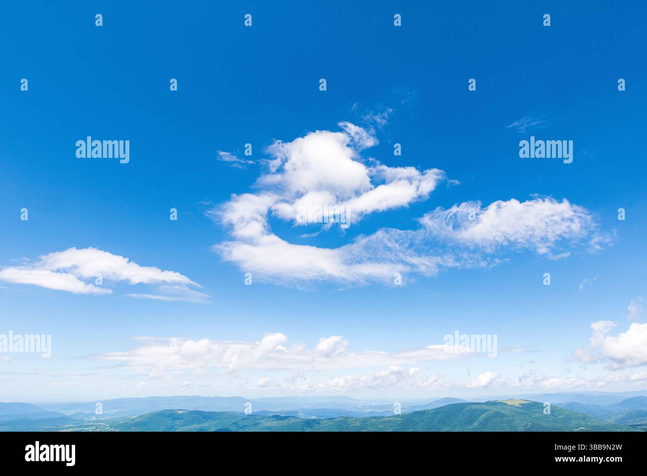 white cumulus clouds on a blue sky. idyllic meteorology backdrop. wonderful nature background of atmosphere condition in day light. bright summer weat Stock Photo