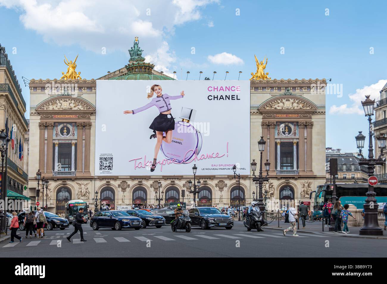 Advertising billboard for Chance Eau Splendide fragrance by Chanel over the restoration works on the facade of the Paris Opera house (Palais Garnier) Stock Photo