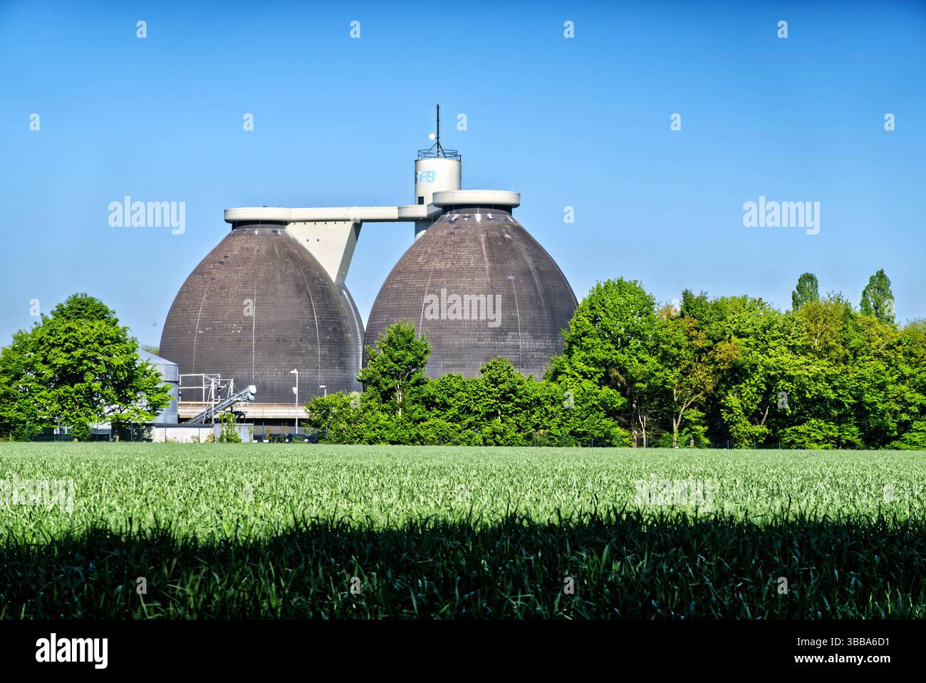 Two large anaerobic digesters dominate the landscape, converting ...