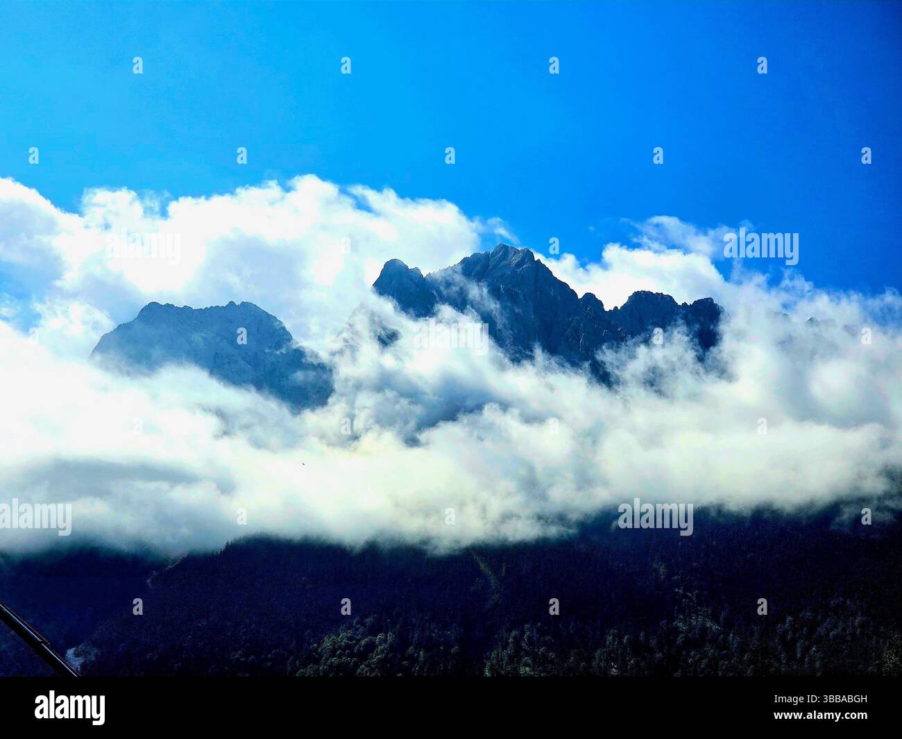 When the mountains touch the clouds - a breathtaking reminder of nature's grandeur. - Smartphone Captured Stock Image