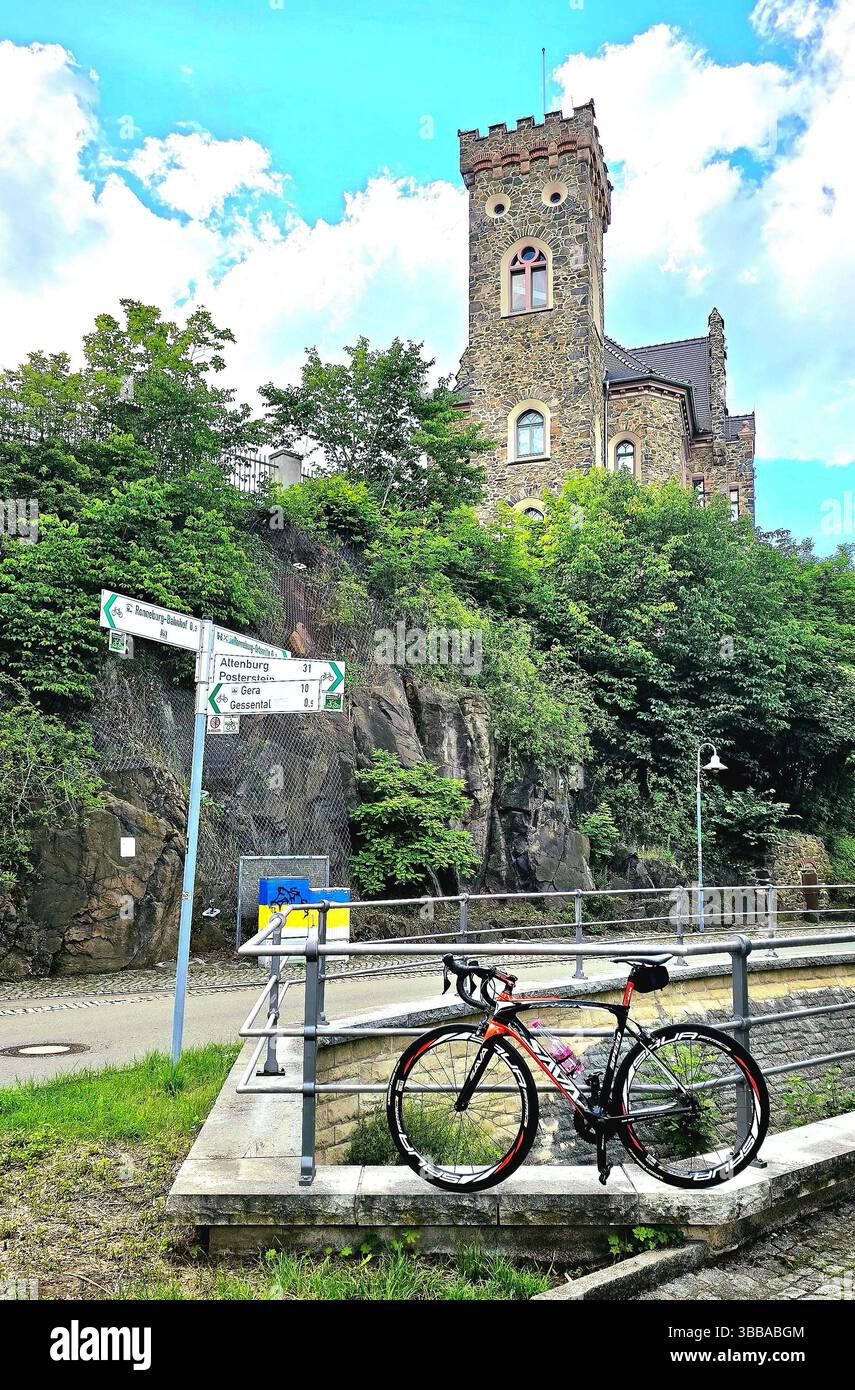Bicycle parked near historical castle on a sunny day. - Smartphone Captured Stock Image