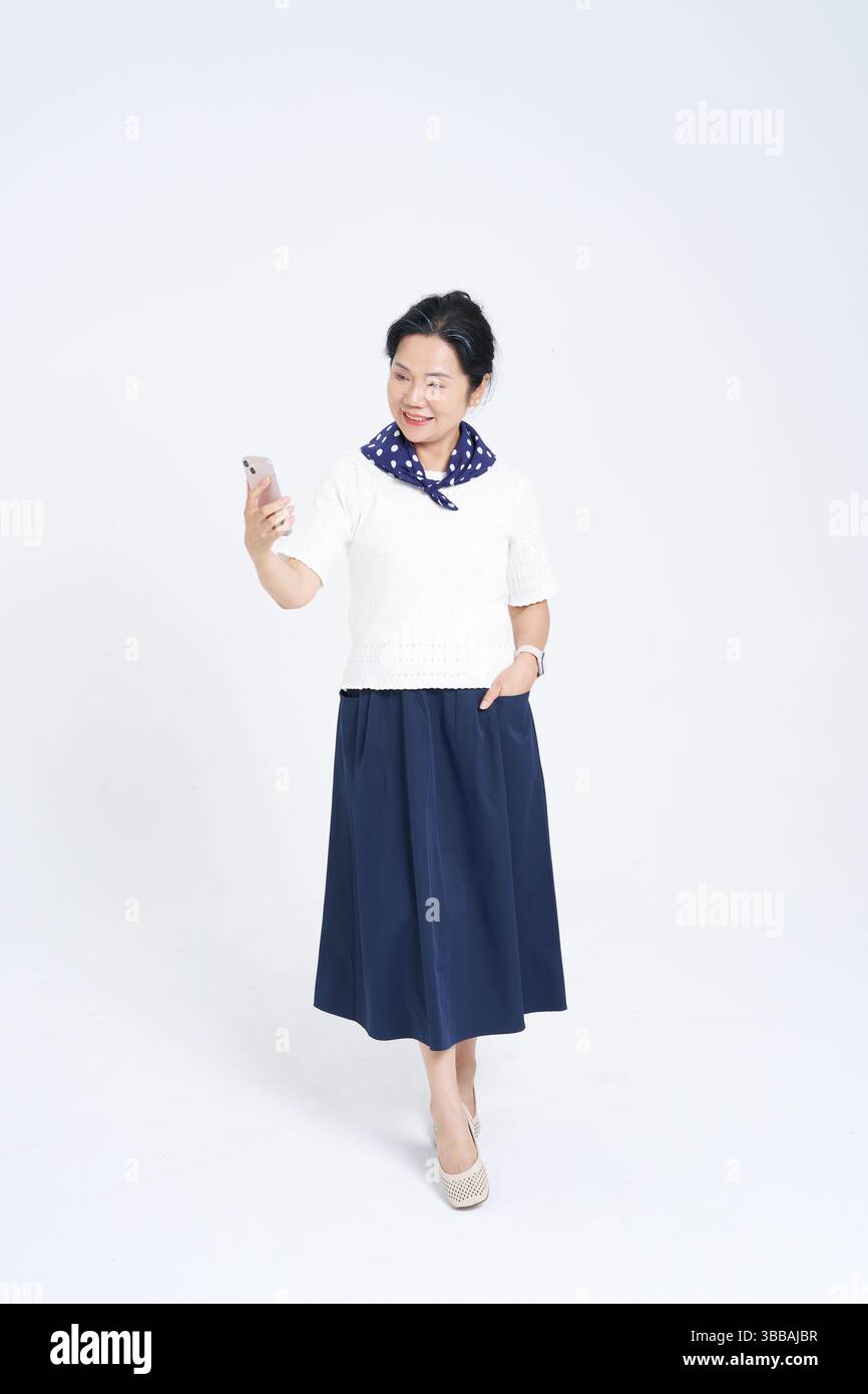 Chinese elderly women using smartphones​ Stock Photo