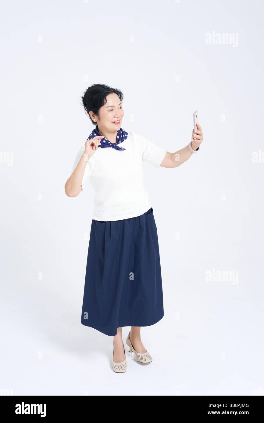 Chinese elderly women using smartphones​ Stock Photo
