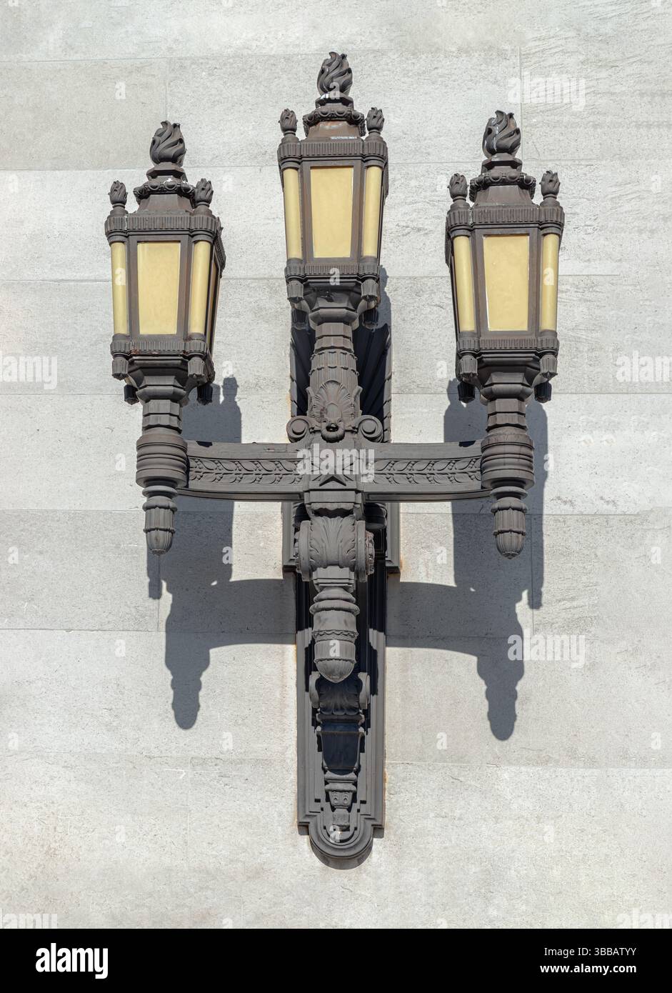 London, UK - May 13, 2025 - Classic Art Deco style Black Cast Iron Lanterns on the wall by the entrance of the Freemasons' Hall in London. Vintage orn Stock Photo