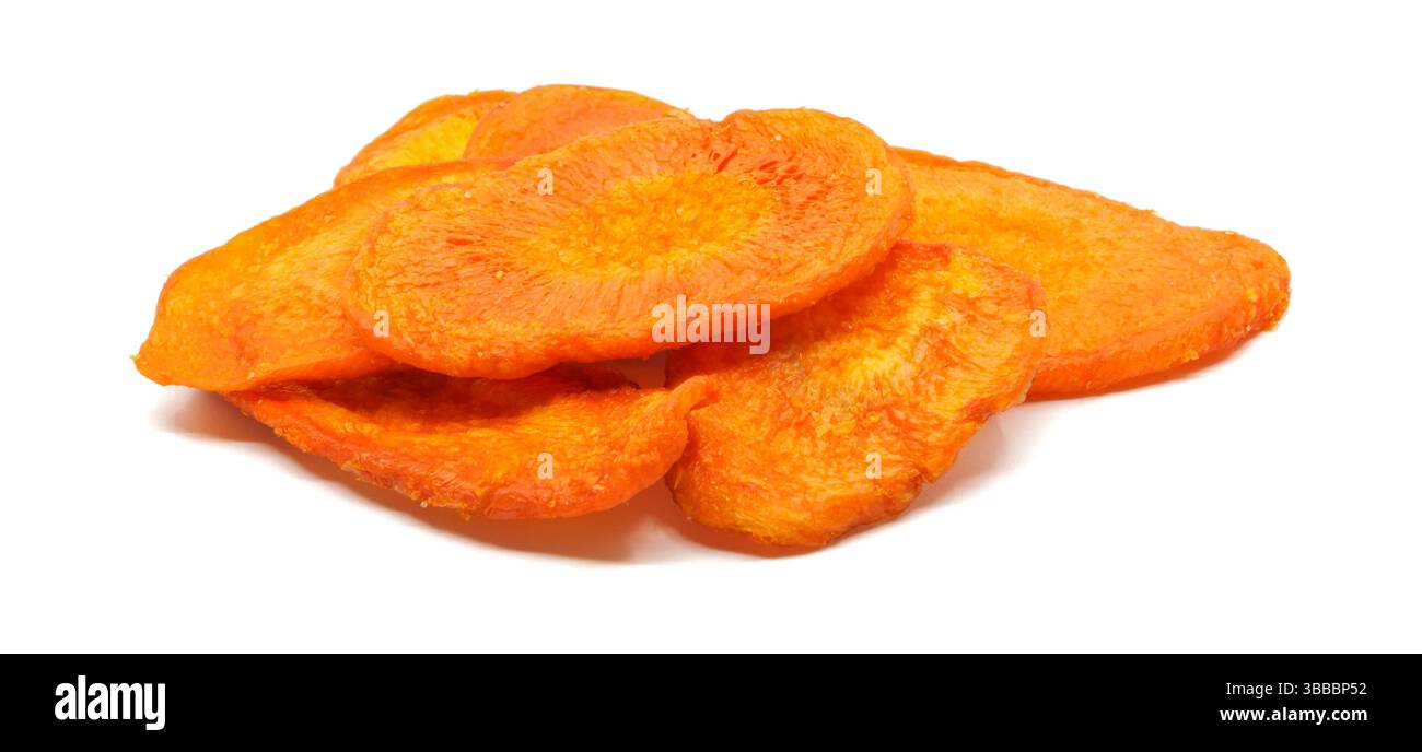 Dried carrot chips portion on a white background side view. Stock Photo