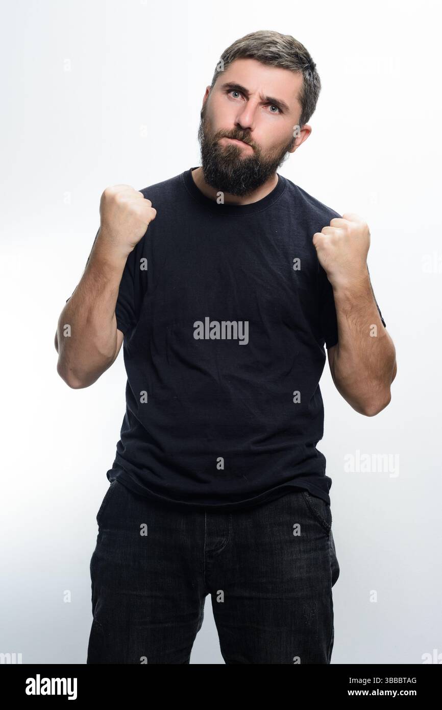 Strong man stands arms hi-res stock photography and images - Alamy