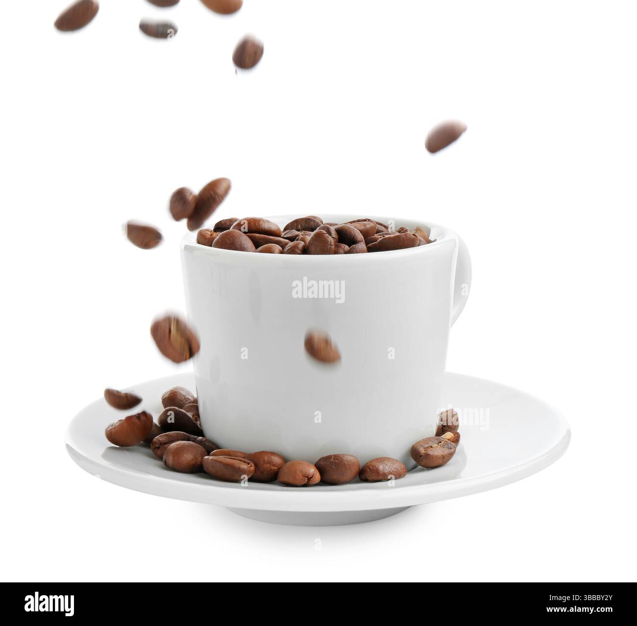 Roasted coffee beans falling into cup isolated on white Stock Photo - Alamy