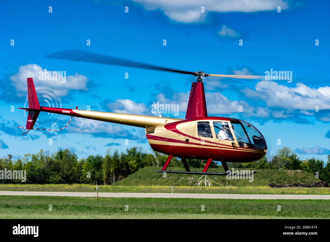 Right side view of helicopter heading into the sky Stock Photo - Alamy
