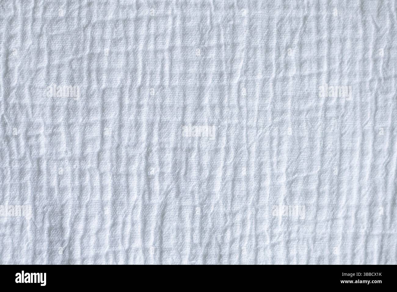 Textured white fabric background with soft folds and subtle linear pattern design Stock Photo