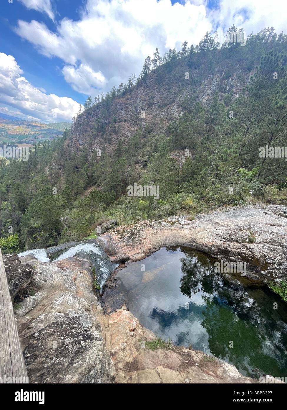 Stunning view from top of waterfall in the mountains on a tropical island - Smartphone Captured Stock Image