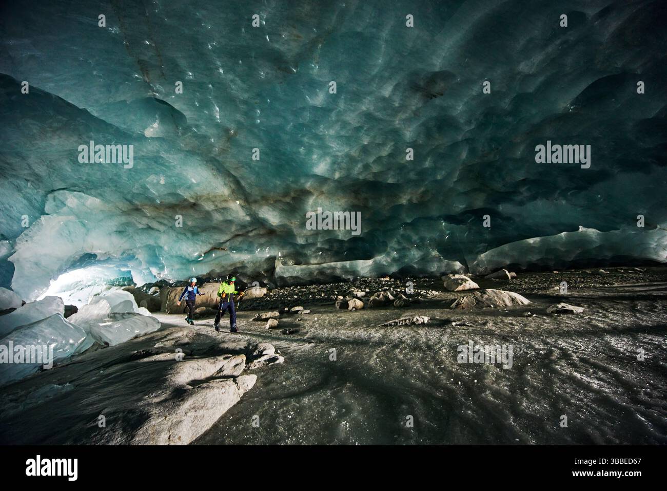 Hikers Walking Through The Interior Of The Morteratsch Glacier Ice hikers-walking-through-the-interior-of-the-morteratsch-glacier-ice
