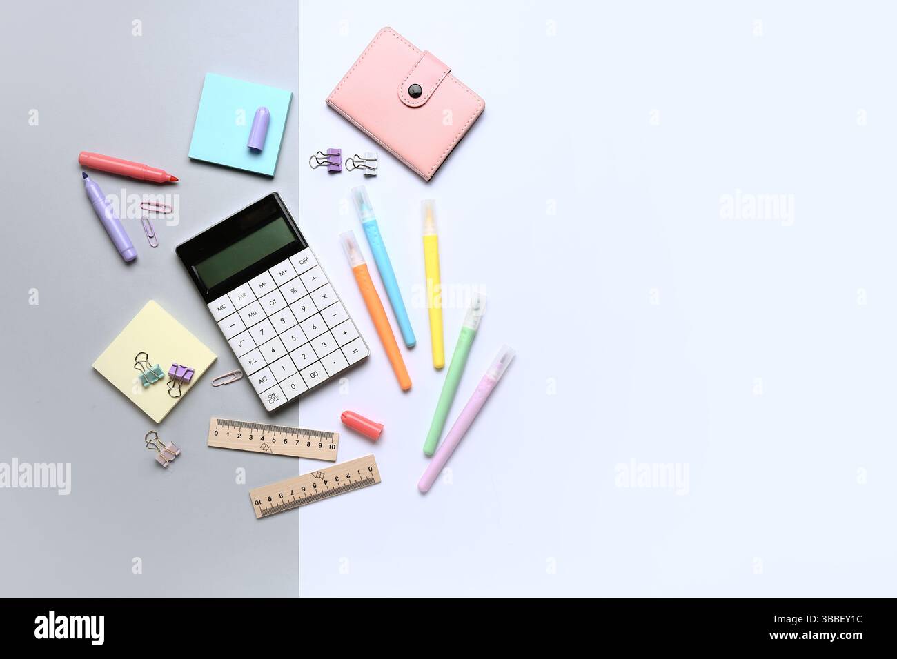 Modern calculator with different stationery on color background Stock Photo