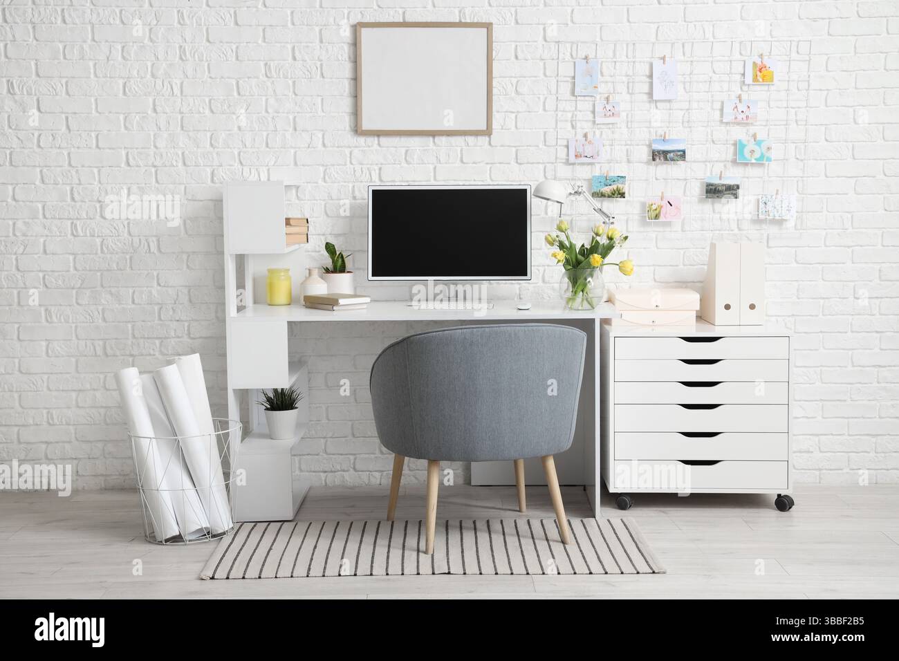 Interior of office with workplace, flowers and pin board Stock Photo ...
