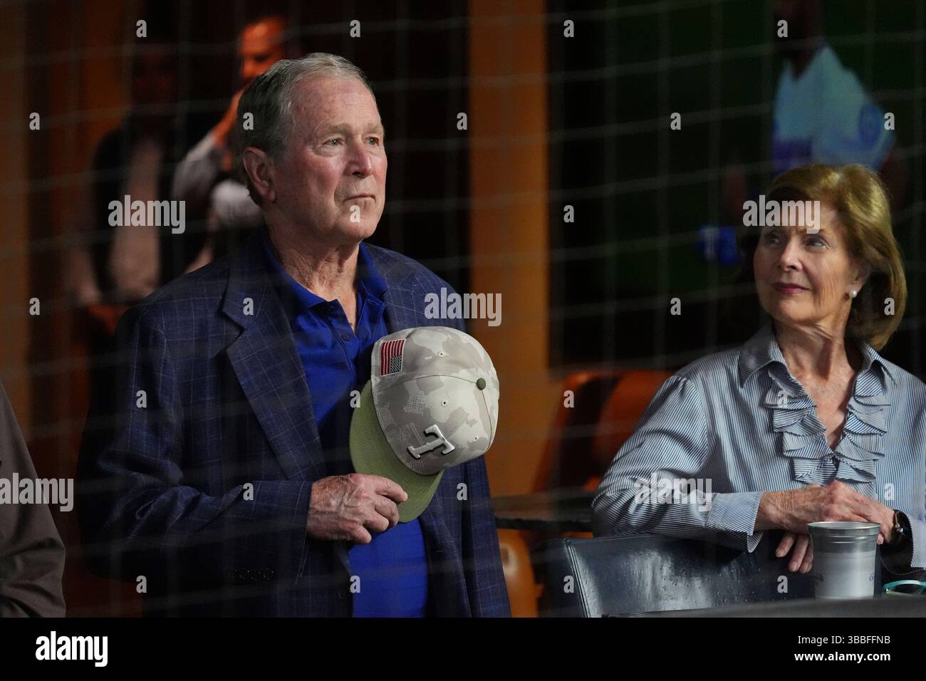 Former President George W. Bush, left, and former first lady Laura Bush ...