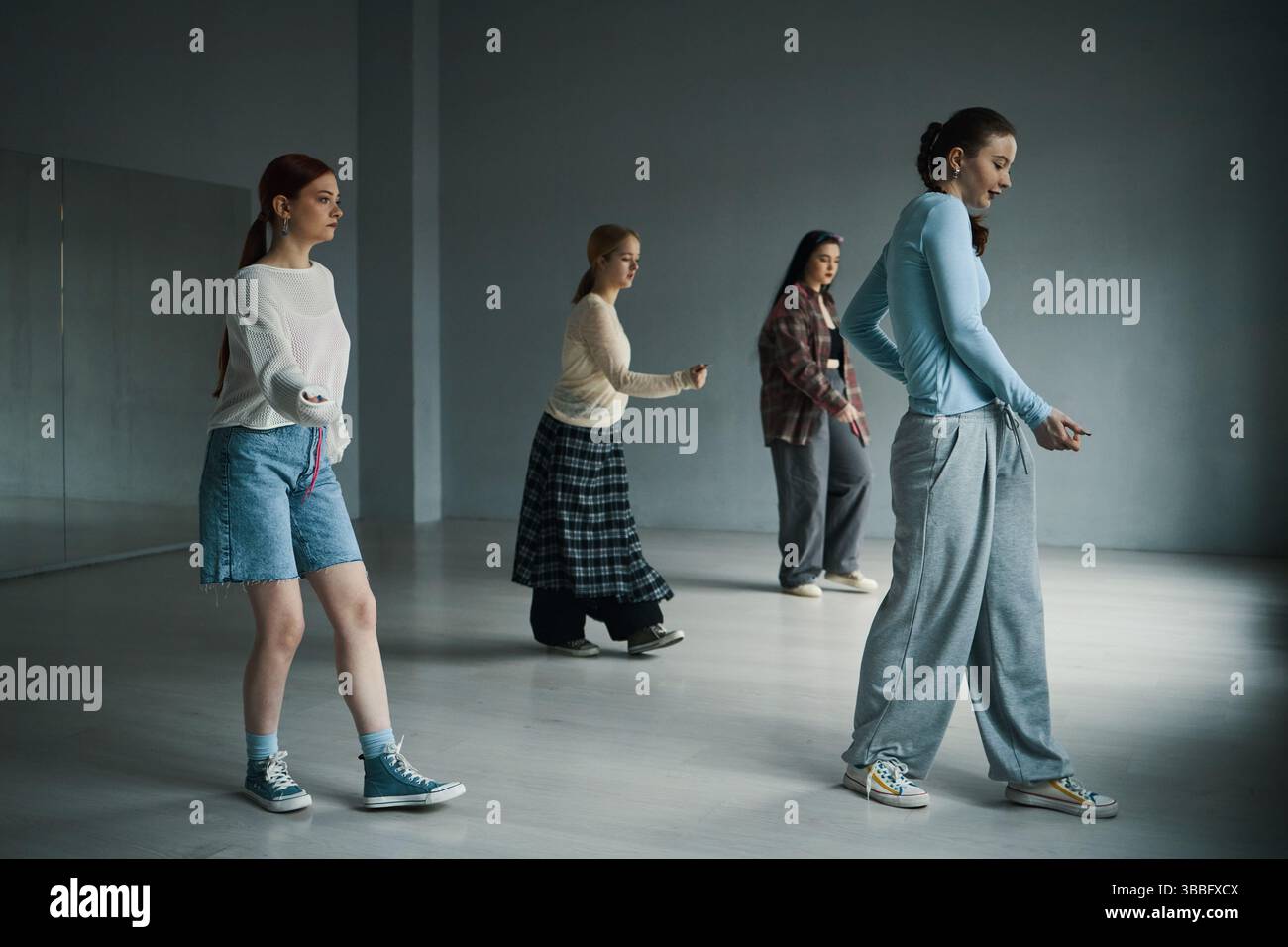 Group Of Young Women Practicing Dance Moves In A Spacious Studio Having