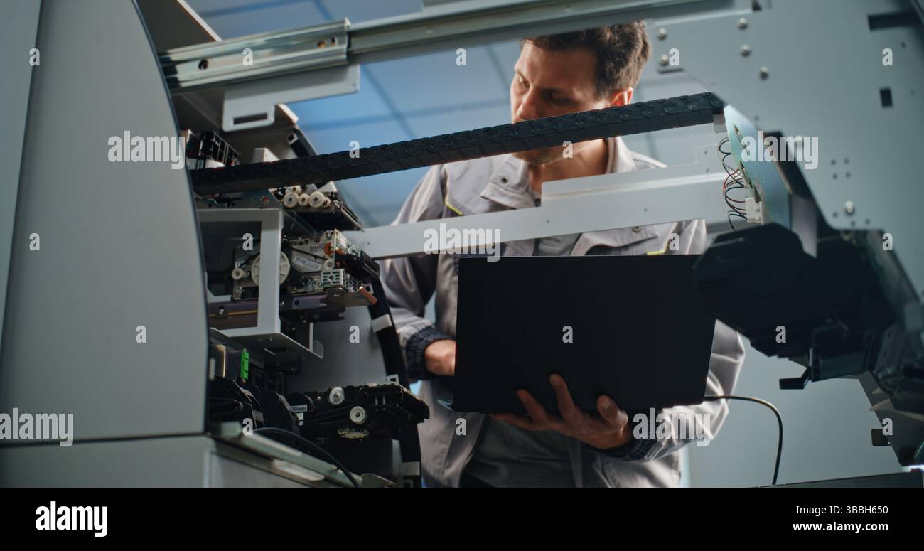 Technician Servicing ATM Machine in Modern Airport Terminal. Male ...