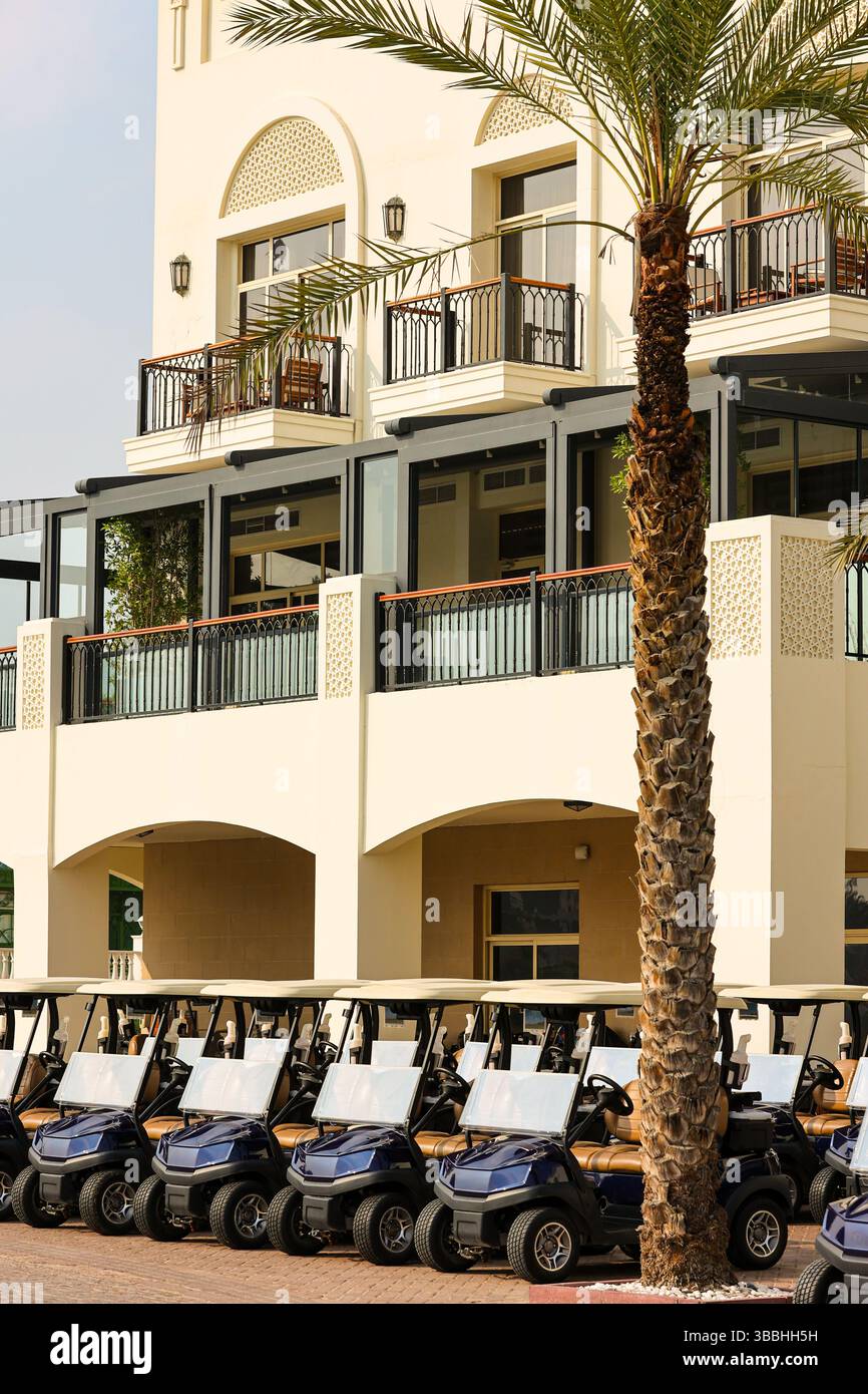 Picture of Luxury Golf Resort with Row of Golf Carts Stock Photo - Alamy