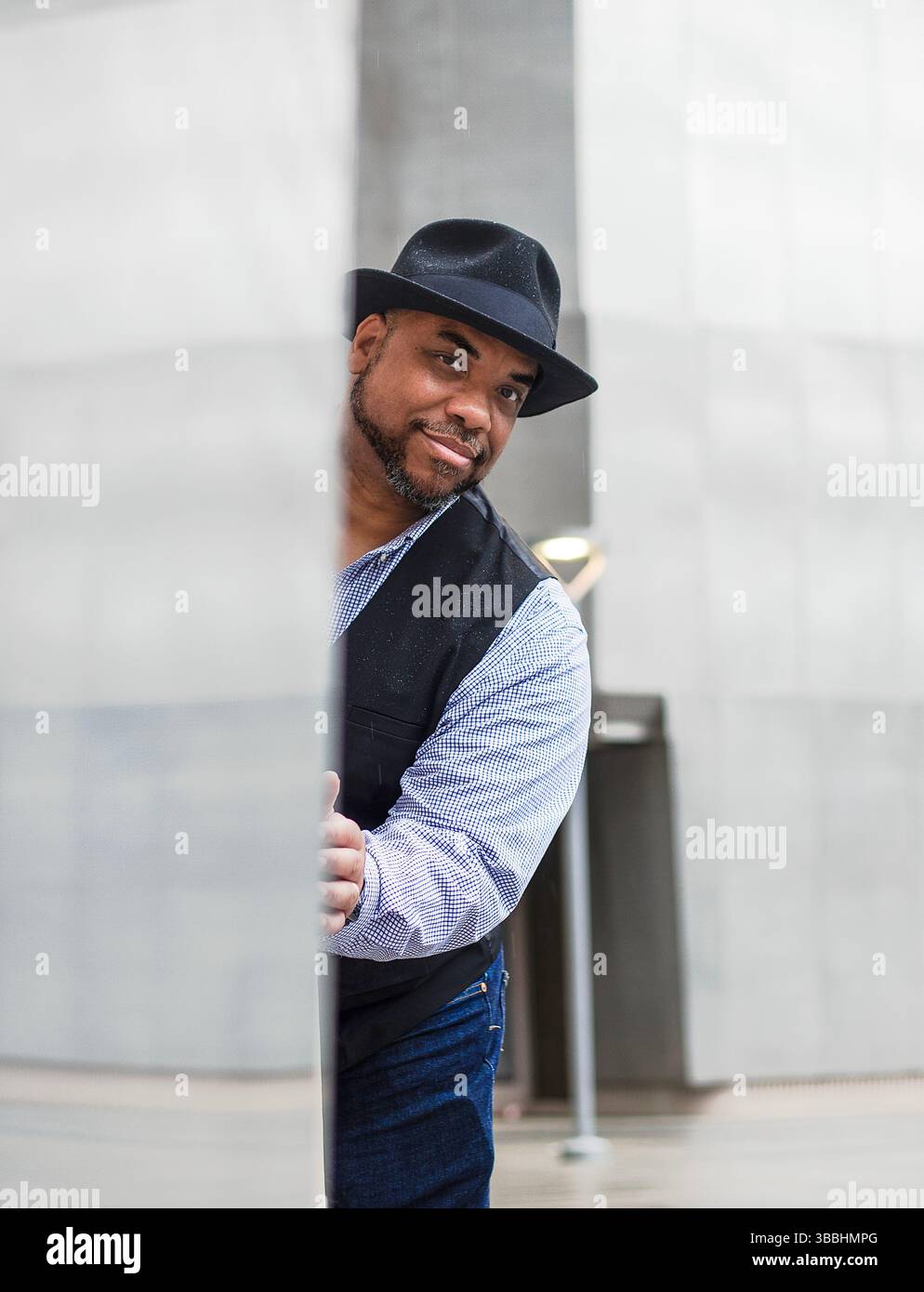 Man hat black vest hi-res stock photography and images - Alamy