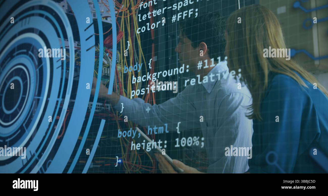 Collaborating IT technicians adjusting network cables in server rack ...