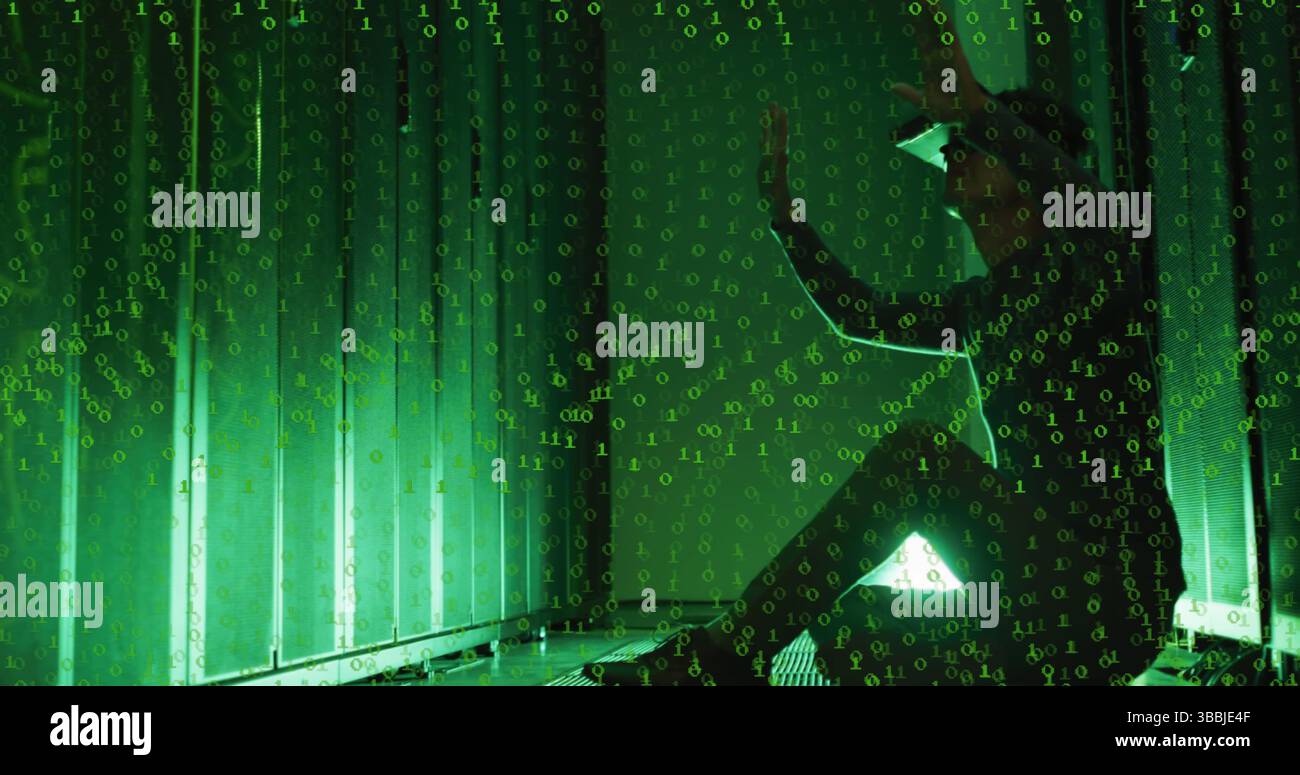 Image of binary code over asian man with vr headset working in server room Stock Photo