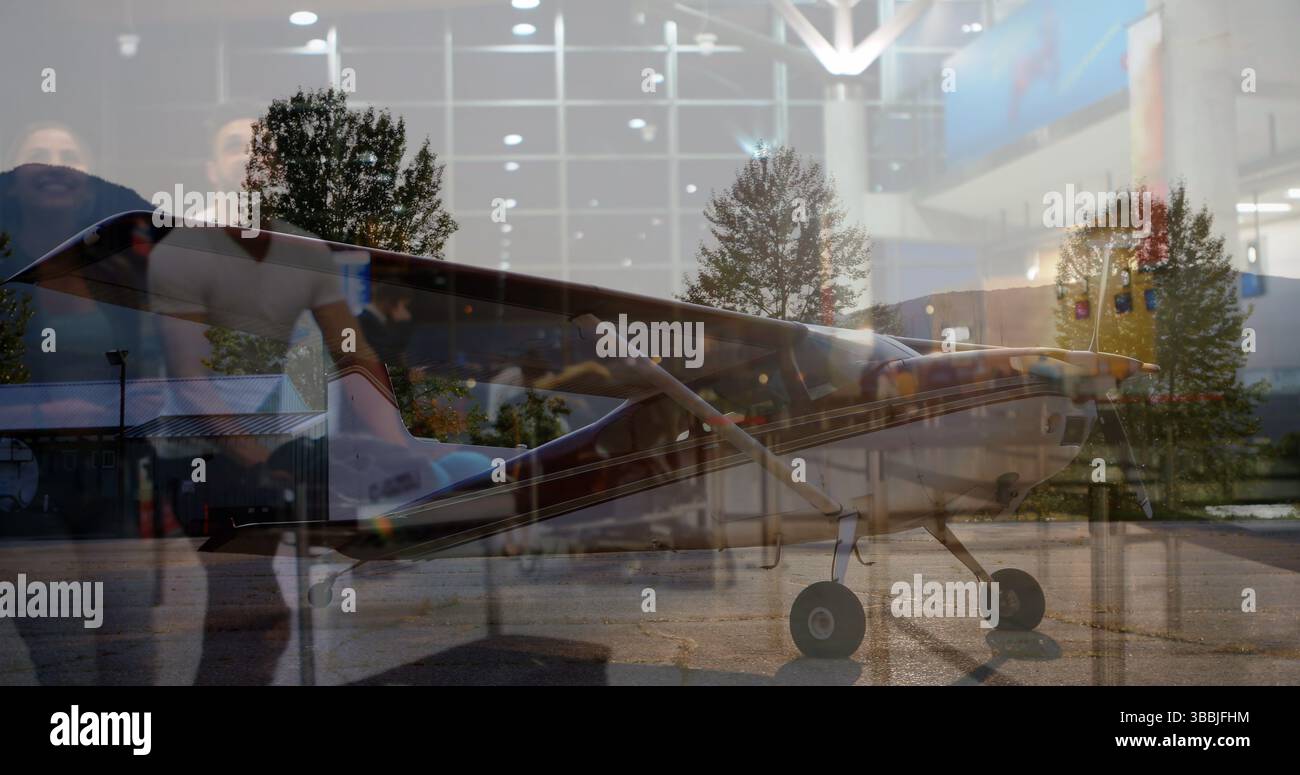 Image of diverse people waiting in airport over airplane Stock Photo