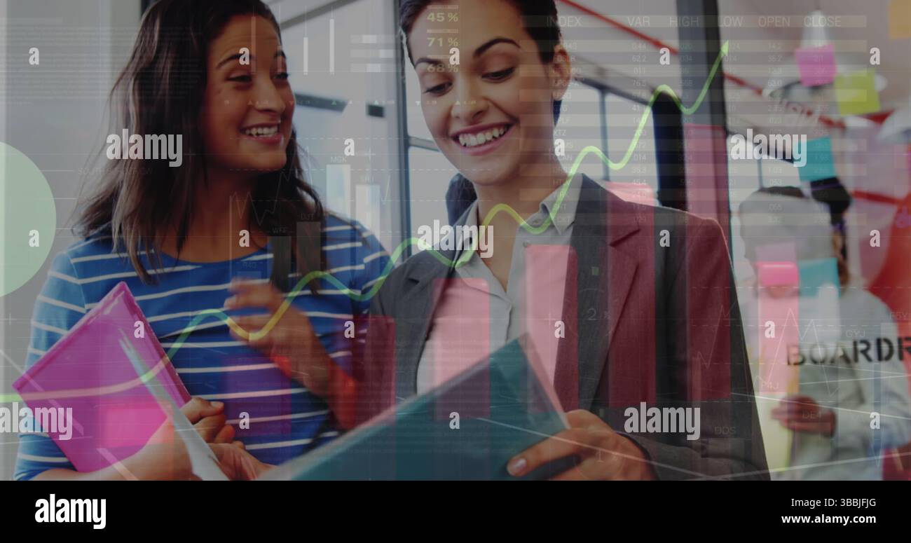 Image of statistical data processing over two diverse women discussing over documents at office Stock Photo