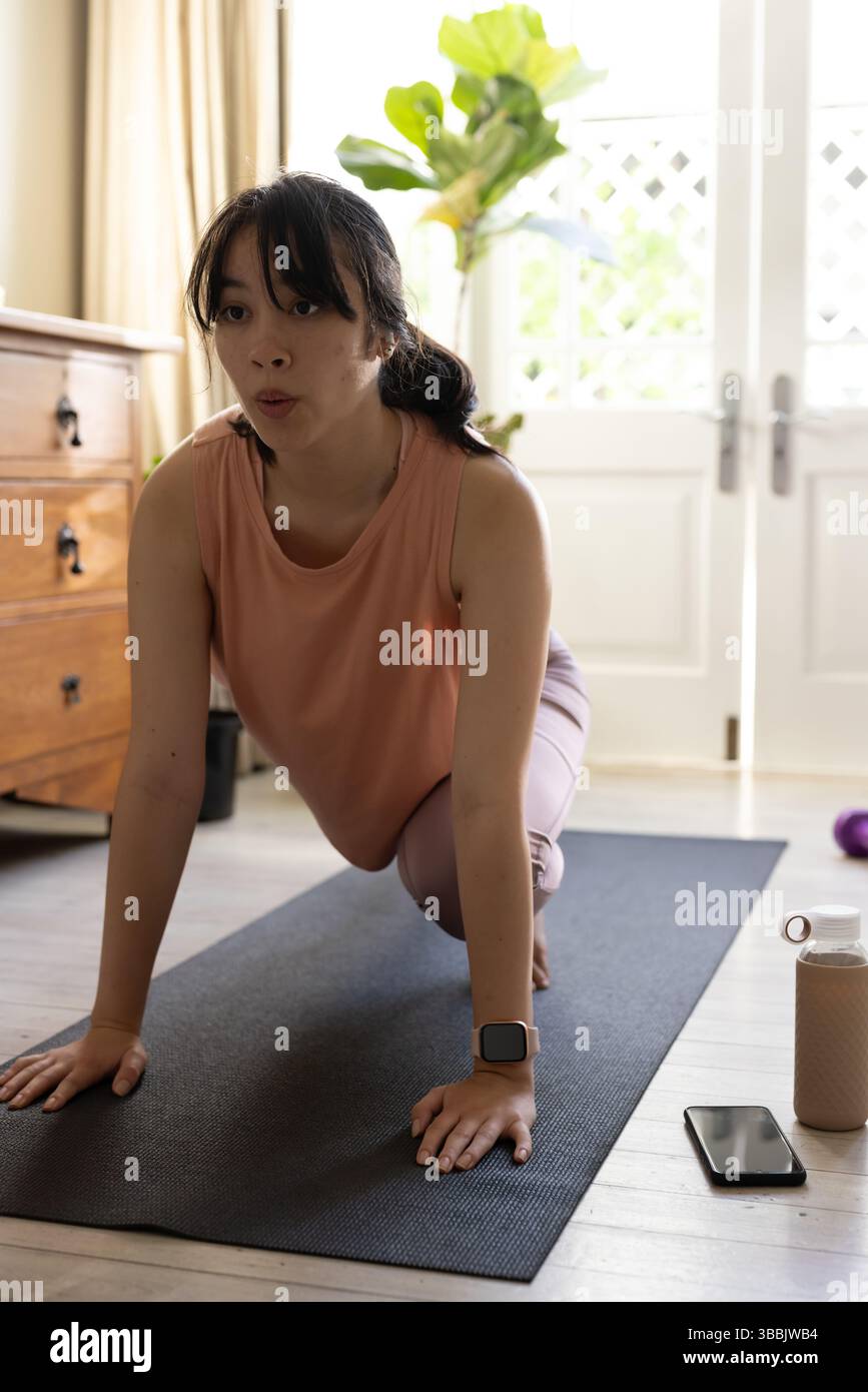 Kneeling woman pink top hi-res stock photography and images - Alamy