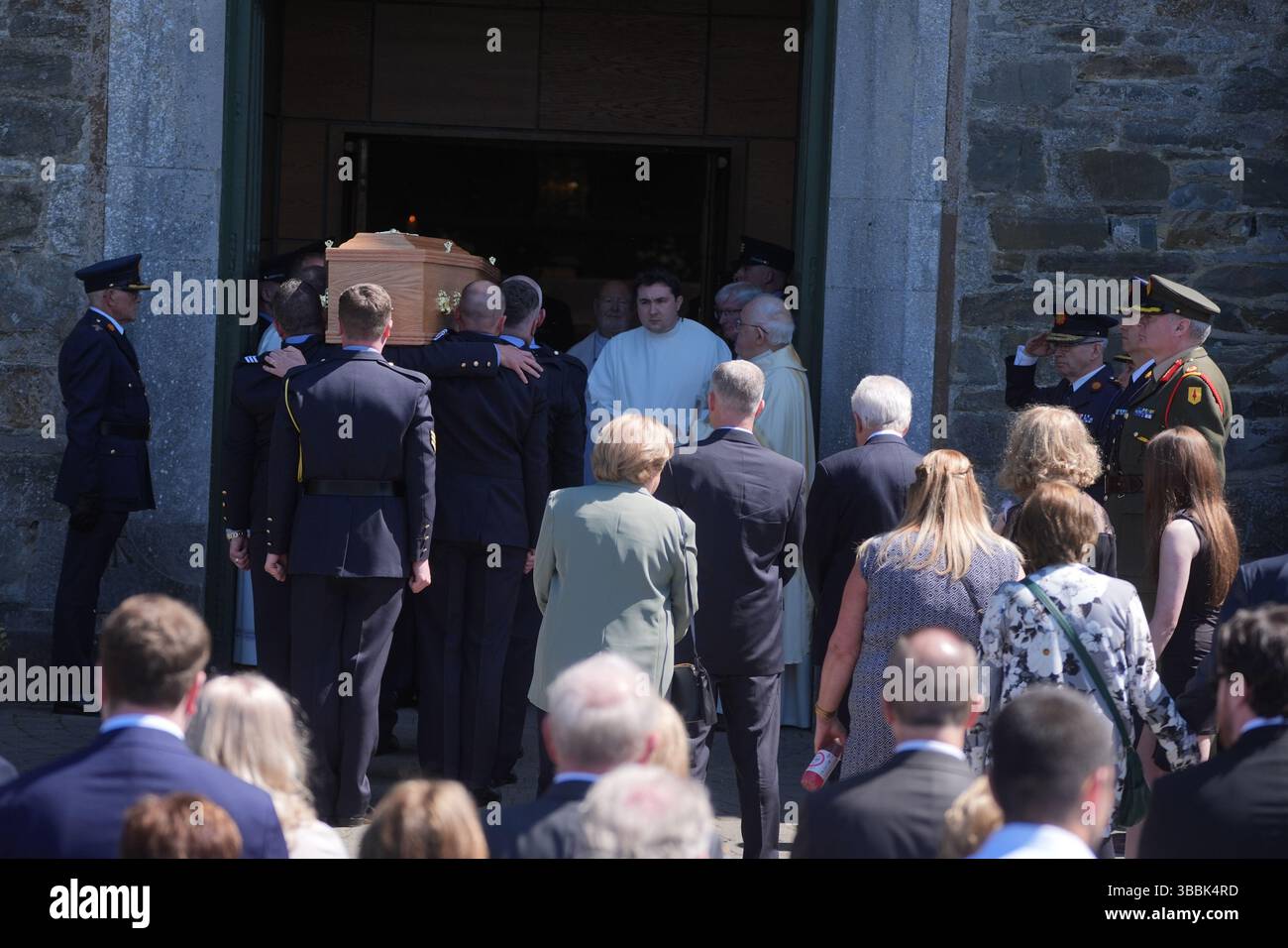 The coffin of Garda officer Kevin Flatley is carried in to St. Peter ...