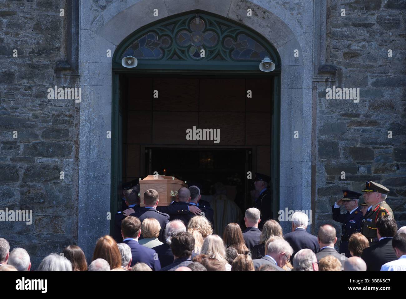 The coffin of Garda officer Kevin Flatley is carried in to St. Peter ...
