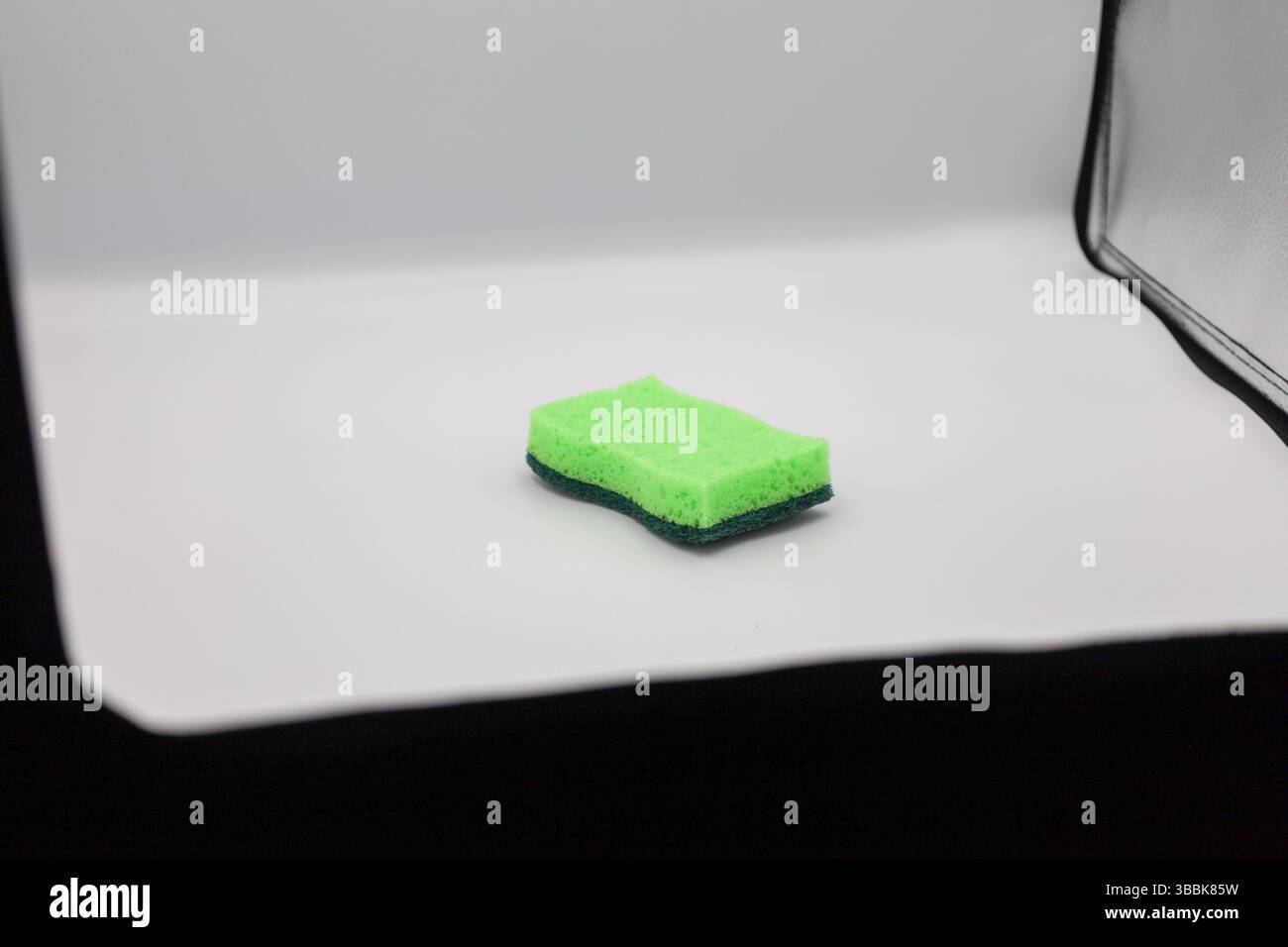 Green sponge in different positions and conditions Stock Photo