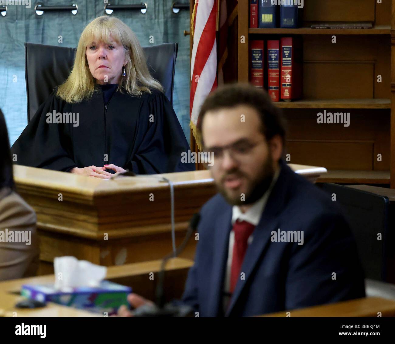 Judge Beverly Cannone, left, listens as Andre Porto of the Massachuetts ...