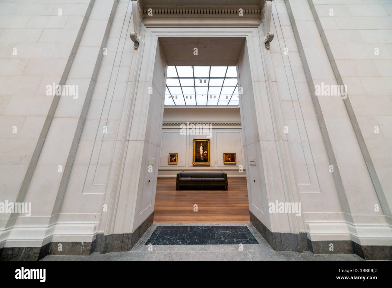 WASHINGTON DC — 'The Emperor Napoleon in His Study at the Tuileries,' painted in 1812 by Jacques-Louis David, hangs in Gallery 56 on the Main Floor of the National Gallery of Art's West Building. This life-sized portrait depicts Napoleon Bonaparte in his imperial uniform, standing before his desk at 4:13 in the morning with nearly extinguished candles, suggesting he has worked through the night on the Napoleonic Code visible on the desk. The portrait showcases David's mastery of Neoclassical portraiture while presenting a carefully crafted image of Napoleon as a tireless leader working for the Stock Photo