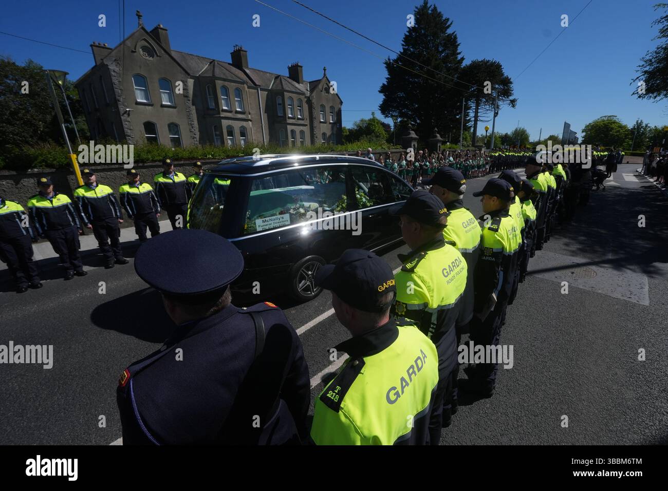 Garda colleagues and members of the DMR Roads Policing unit, form a ...