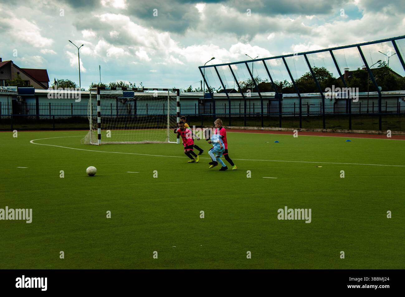 Action photo of school football players making amazing plays during a football game Stock Photo