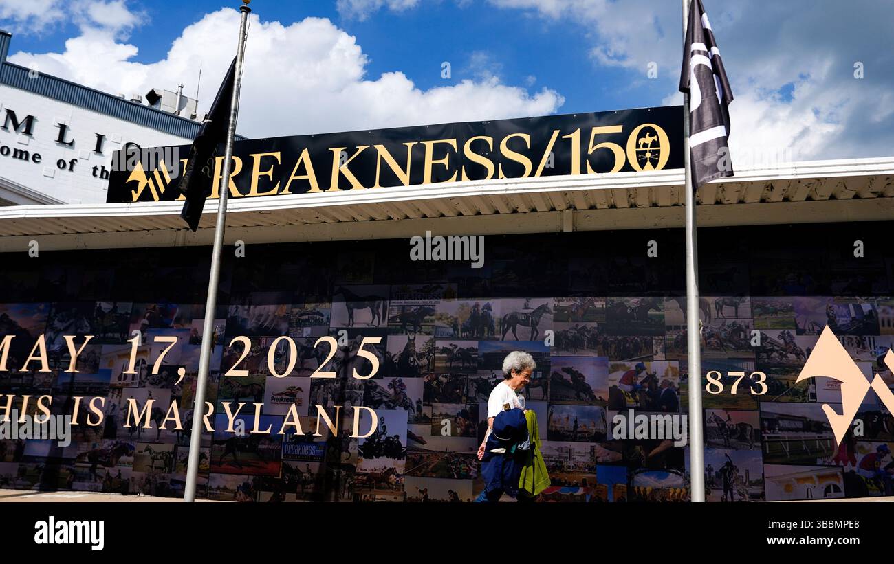 A woman walks outside Pimlico Race Course ahead of the 150th running of Will 2025 Preakness Only Be Outside Pimlico