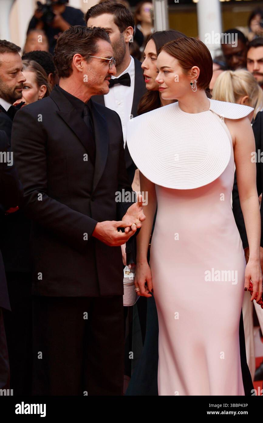 Pedro Pascal, left, and Emma Stone pose for photographers upon arrival ...