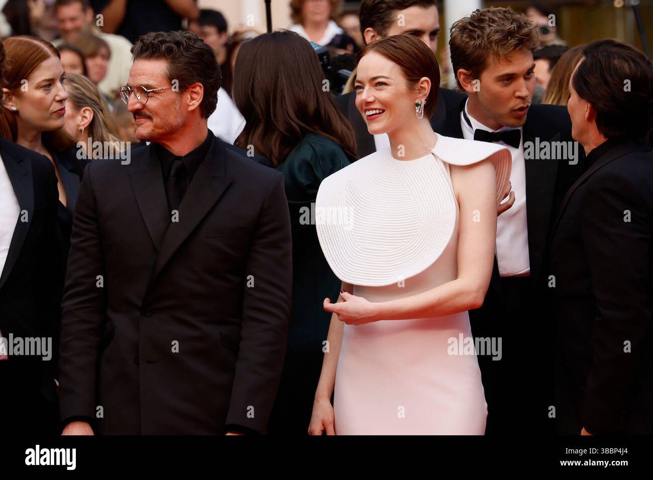Pedro Pascal, left, and Emma Stone pose for photographers upon arrival ...