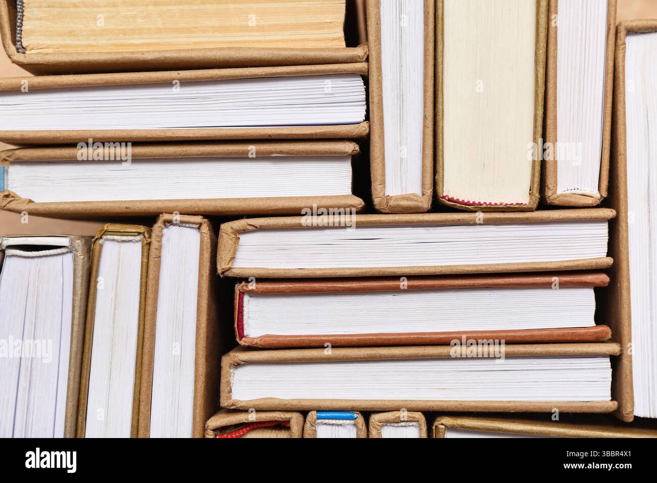 Many different half open books as background, top view Stock Photo