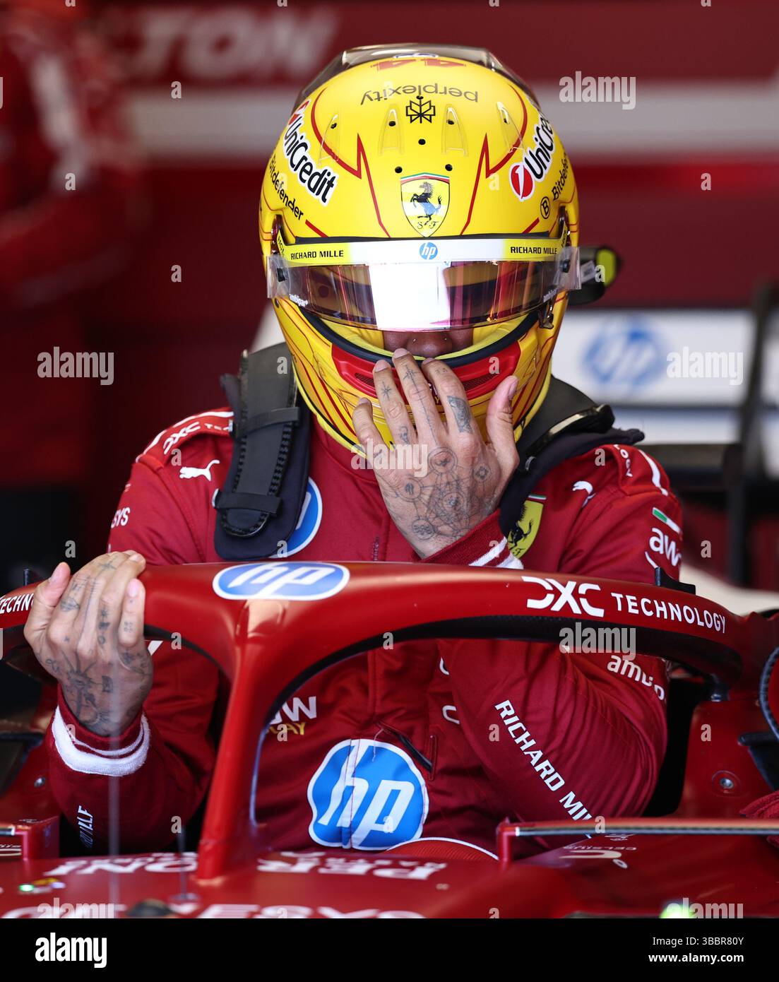 Imola. 16th May, 2025. Ferrari's driver Lewis Hamilton of Britain prepares before the second practice session at the Autodromo Internazionale Enzo e Dino Ferrari race track in Imola, Italy, May 16, 2025, ahead of the Formula One Emilia Romagna Grand Prix. Credit: Li Jing/Xinhua/Alamy Live News Stock Photo