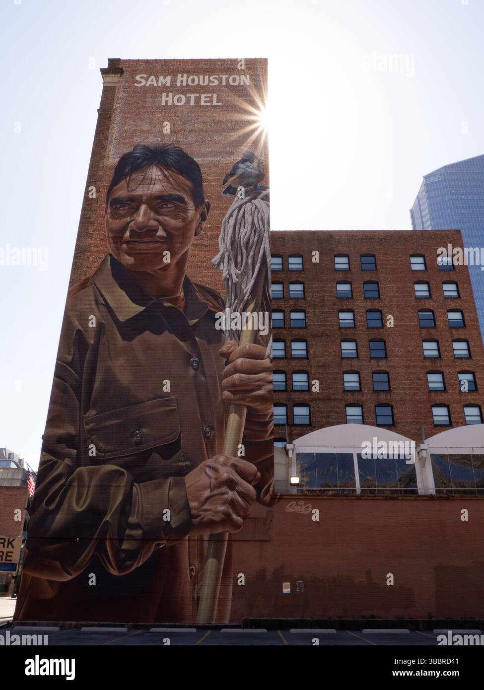 Assiduity or No Poverty mural on the Sam Houston Hotel by artist smogone dedicated to the essential workers who served during the pandemic. Photograph Stock Photo