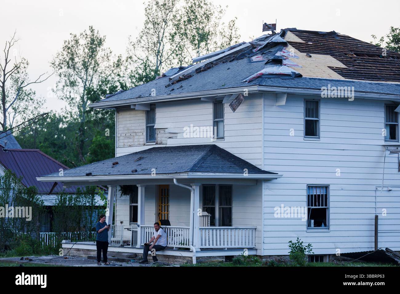 A house next to the Clear Creek post has a damaged roof after a tornado ...