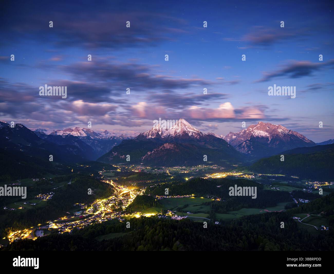 Starry sky at dawn over the valley basin of Berchtesgaden, behind the ...