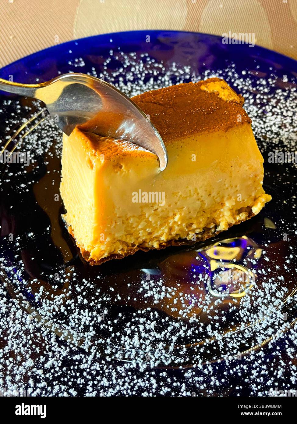 Eating creme caramel. - Smartphone Captured Stock Image
