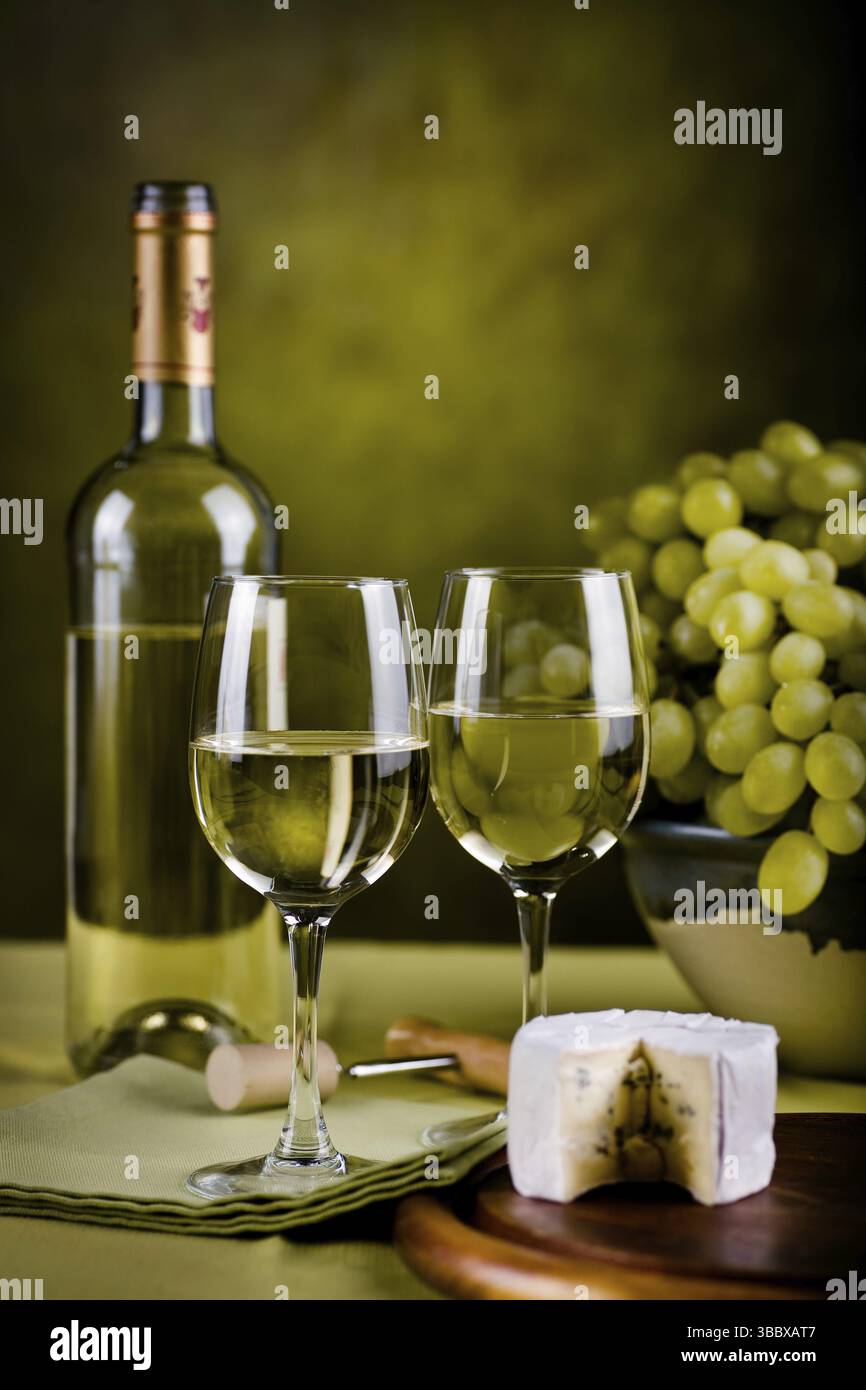 Still life with wine bottle and cheese Stock Photo - Alamy
